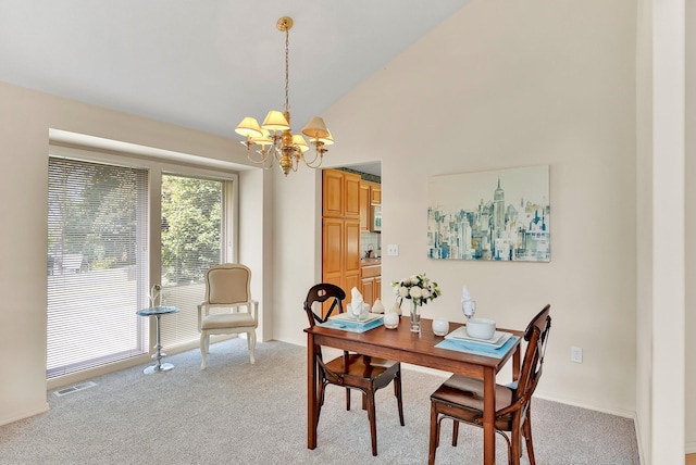 4605 E Birkdale Ln, Spokane, WA 99223 - dining area with a chandelier, light carpet, vaulted ceiling, and baseboards