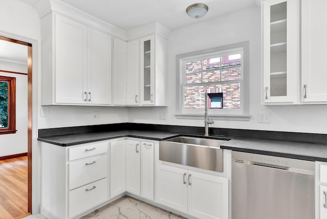 411 W 26th Ave, Spokane, WA 99203 - kitchen with stainless steel dishwasher, a sink, dark countertops, and white cabinetry