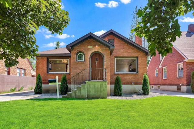 411 W 26th Ave, Spokane, WA 99203 - view of front facade with brick siding and a chimney