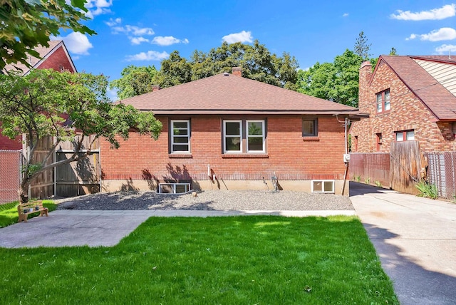 411 W 26th Ave, Spokane, WA 99203 - rear view of house featuring brick siding, a chimney, a patio, and roof with shingles