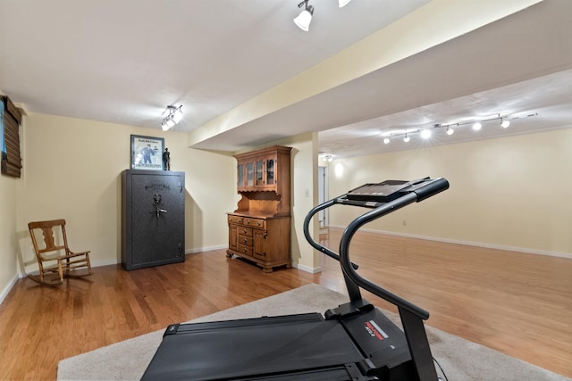 11605 N Merlin Dr, Spokane, WA 99218 - workout room featuring wood finished floors, baseboards, and rail lighting