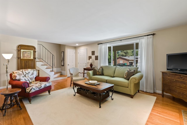 11605 N Merlin Dr, Spokane, WA 99218 - living area featuring wood finished floors, stairs, and baseboards