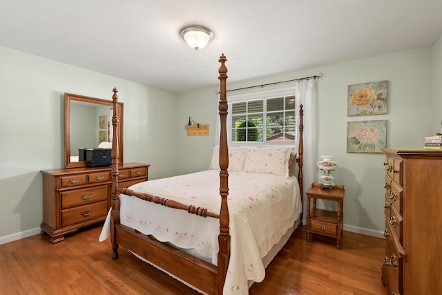 11605 N Merlin Dr, Spokane, WA 99218 - bedroom with wood finished floors and baseboards