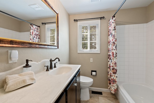 11605 N Merlin Dr, Spokane, WA 99218 - full bath featuring plenty of natural light, vanity, toilet, tile patterned flooring, and a textured wall