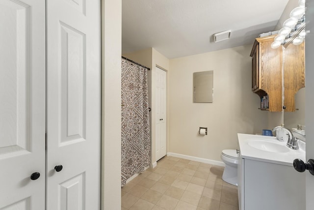 202 E Weile Ave Unit 2, Spokane, WA 99208 - full bath with vanity, toilet, baseboards, and tile patterned floors