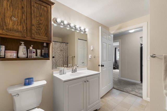 202 E Weile Ave Unit 2, Spokane, WA 99208 - full bathroom featuring vanity, toilet, tile patterned floors, and baseboards