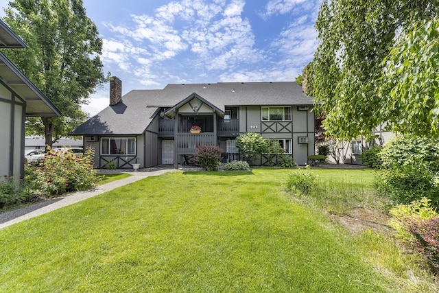 202 E Weile Ave Unit 2, Spokane, WA 99208 - view of front of house with a chimney, a front lawn, and a shingled roof