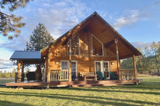 31579 E Hume Rd, Davenport, WA 99122 - rear view of house with a lawn, a deck, and metal roof