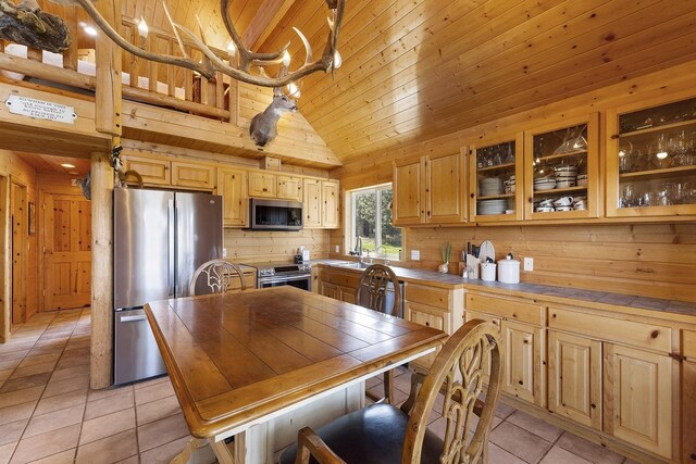 31579 E Hume Rd, Davenport, WA 99122 - kitchen featuring appliances with stainless steel finishes, a sink, light tile patterned floors, wooden ceiling, and light brown cabinets