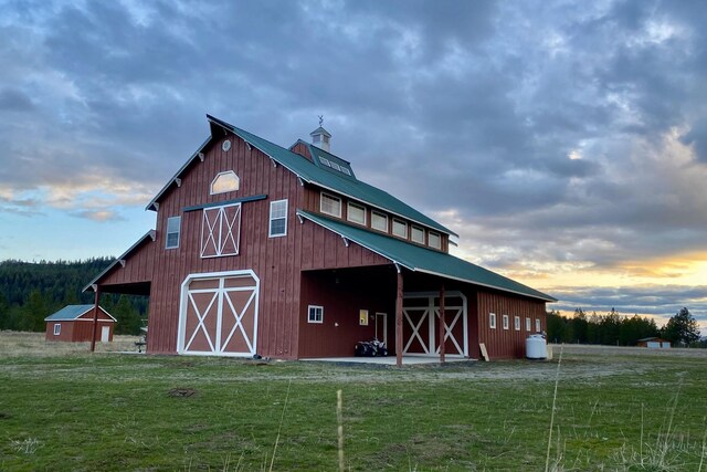 31579 E Hume Rd, Davenport, WA 99122 - outdoor structure at dusk featuring a barn and a yard