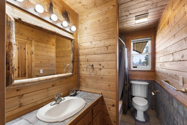31579 E Hume Rd, Davenport, WA 99122 - bathroom with wooden walls, vanity, toilet, shower / tub combo with curtain, and wood ceiling