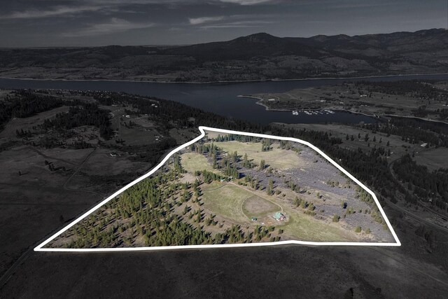 31579 E Hume Rd, Davenport, WA 99122 - aerial view of property and surrounding area featuring property boundaries highlighted and a water and mountain view