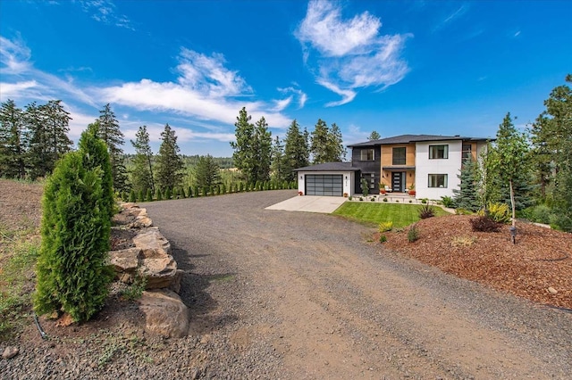 9610 S Mullen Hill Rd, Spokane, WA 99224 - view of front of home with driveway, an attached garage, and stucco siding