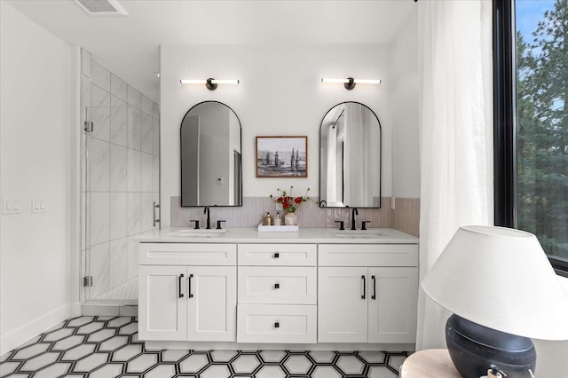 9610 S Mullen Hill Rd, Spokane, WA 99224 - bathroom with a stall shower, double vanity, and baseboards