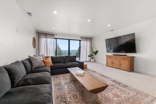 9610 S Mullen Hill Rd, Spokane, WA 99224 - living area with light colored carpet, recessed lighting, and baseboards