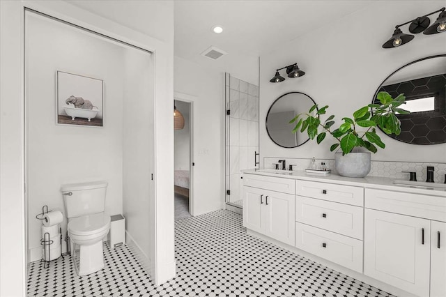 9610 S Mullen Hill Rd, Spokane, WA 99224 - bathroom featuring double vanity, ensuite bath, toilet, backsplash, and recessed lighting
