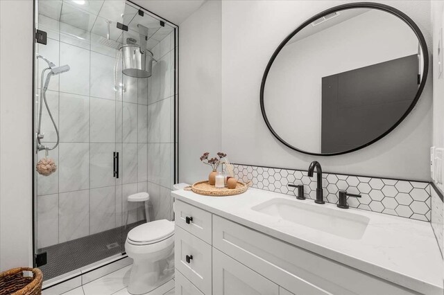 9610 S Mullen Hill Rd, Spokane, WA 99224 - full bath with vanity, a stall shower, toilet, and decorative backsplash