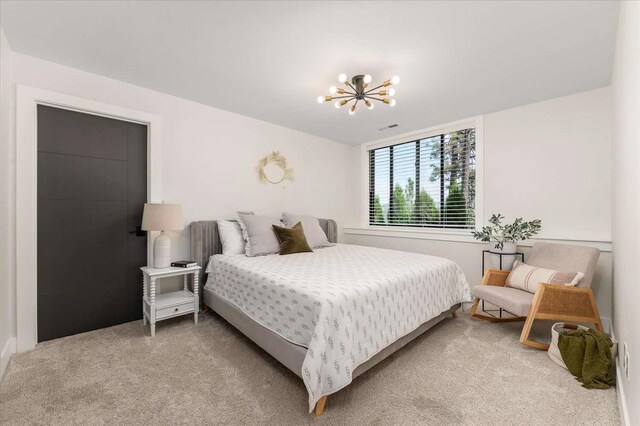 9610 S Mullen Hill Rd, Spokane, WA 99224 - bedroom with a chandelier and light colored carpet