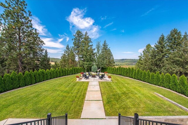 9610 S Mullen Hill Rd, Spokane, WA 99224 - view of grassy yard featuring a patio, agricultural area, and a view of countryside