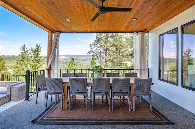 9610 S Mullen Hill Rd, Spokane, WA 99224 - view of patio with outdoor dining space, a ceiling fan, and a mountain view