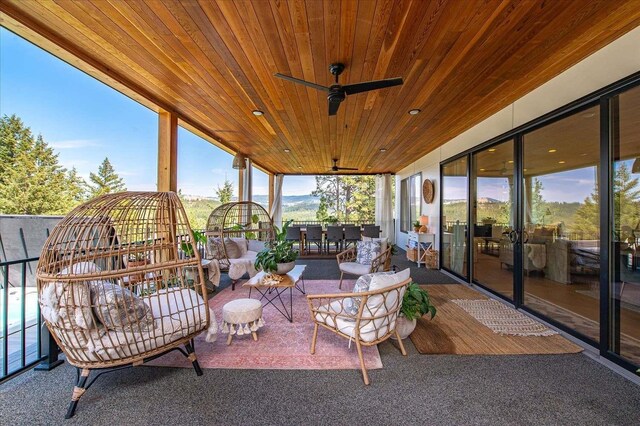 9610 S Mullen Hill Rd, Spokane, WA 99224 - sunroom / solarium with a ceiling fan and an outdoor hangout area