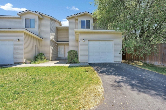 11212 E 4th Ave Unit D, Spokane Valley, WA 99206 - view of front of house featuring asphalt driveway