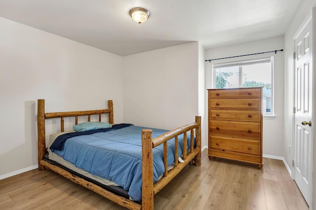 11212 E 4th Ave Unit D, Spokane Valley, WA 99206 - bedroom featuring light wood-type flooring and baseboards