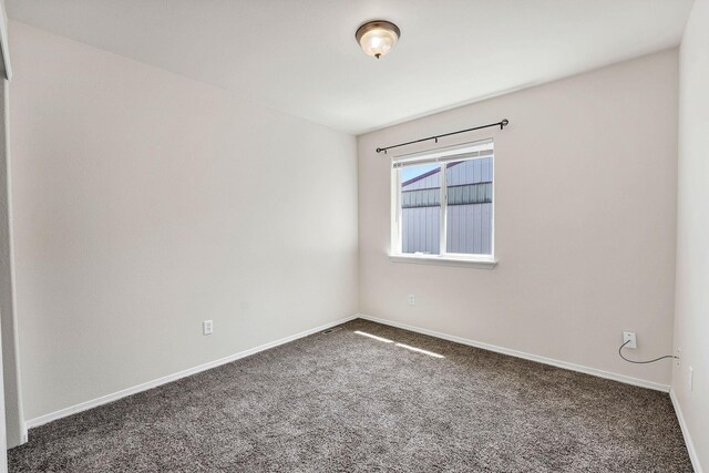 11212 E 4th Ave Unit D, Spokane Valley, WA 99206 - carpeted spare room featuring baseboards
