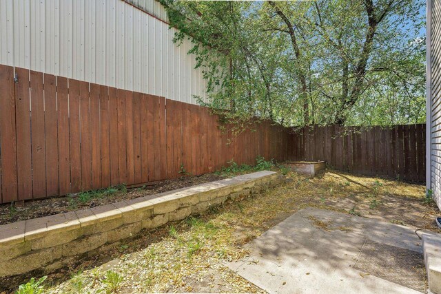 11212 E 4th Ave Unit D, Spokane Valley, WA 99206 - fenced backyard featuring a patio
