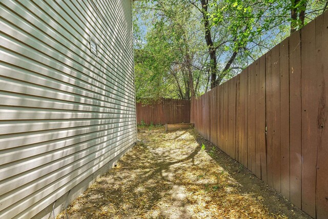11212 E 4th Ave Unit D, Spokane Valley, WA 99206 - view of home's exterior with a fenced backyard