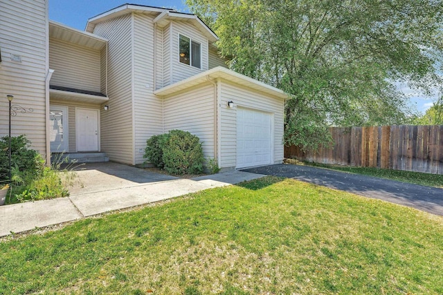 11212 E 4th Ave Unit D, Spokane Valley, WA 99206 - view of front facade featuring driveway and an attached garage
