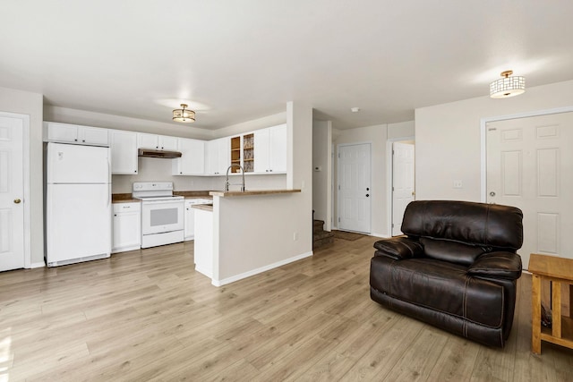 11212 E 4th Ave Unit D, Spokane Valley, WA 99206 - kitchen with white appliances, open floor plan, under cabinet range hood, white cabinets, and light wood-style flooring
