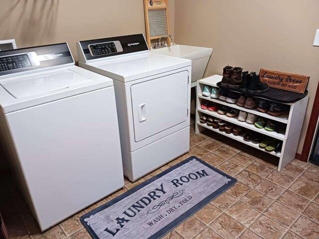 633C Garvey Rd, Colville, WA 99114 - laundry room featuring stone tile floors and washer and dryer