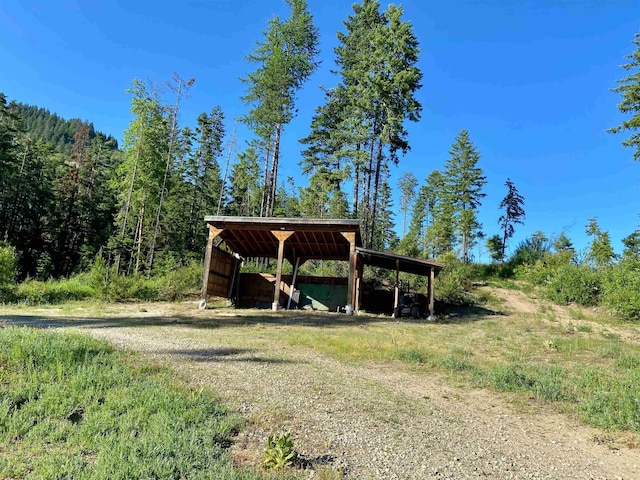 TBD Buck Creek Rd, Newport, WA 99156 - view of home's community featuring an outbuilding, a forest view, and an outdoor structure