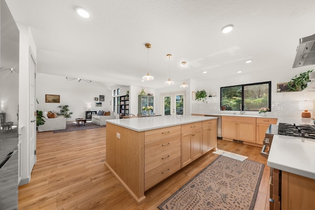 16106 N Mt Spokane Park Dr, Mead, WA 99021 - kitchen featuring light brown cabinets, light countertops, light wood finished floors, french doors, and tasteful backsplash