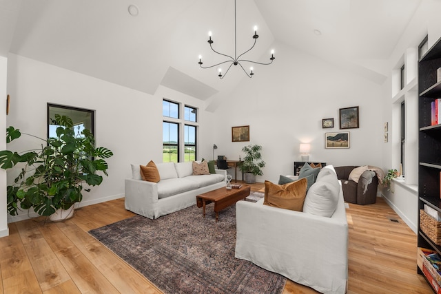 16106 N Mt Spokane Park Dr, Mead, WA 99021 - living room featuring a chandelier, high vaulted ceiling, and light wood-style flooring