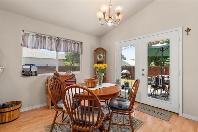 813 Tamarack Ln, Chewelah, WA 99109 - dining space featuring light wood-type flooring, a chandelier, lofted ceiling, baseboards, and french doors