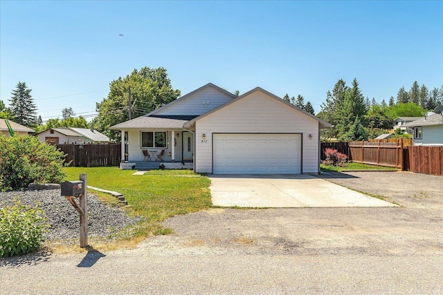 813 Tamarack Ln, Chewelah, WA 99109 - view of front of property with an attached garage, concrete driveway, and a porch