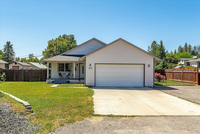 813 Tamarack Ln, Chewelah, WA 99109 - ranch-style home featuring covered porch, an attached garage, and concrete driveway