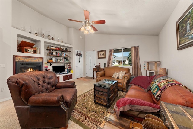 813 Tamarack Ln, Chewelah, WA 99109 - living room with a ceiling fan, a warm lit fireplace, vaulted ceiling, and built in features