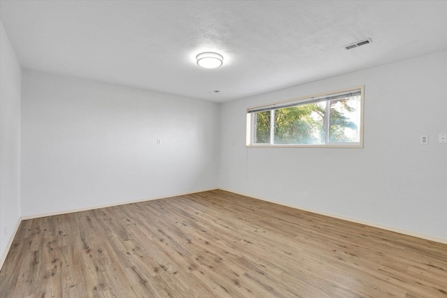 1517 E Olympic Ave, Spokane, WA 99207 - empty room featuring wood finished floors and baseboards