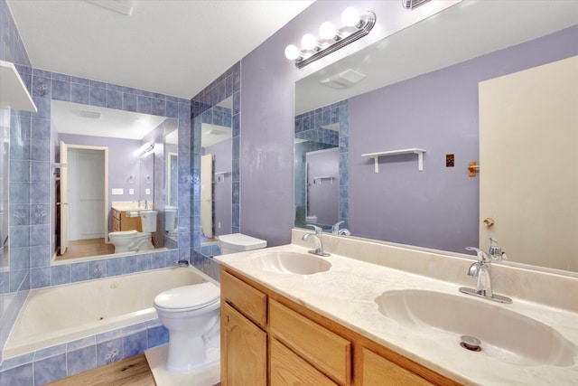 1517 E Olympic Ave, Spokane, WA 99207 - full bath with toilet, tiled tub, double vanity, and a tile shower