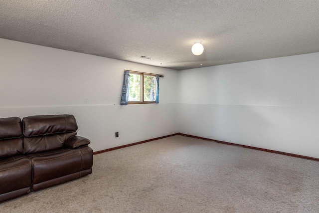 24615 E Joseph Ave, Otis Orchards, WA 99027 - unfurnished living room with carpet, a textured ceiling, and baseboards
