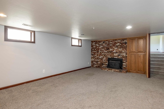 24615 E Joseph Ave, Otis Orchards, WA 99027 - basement featuring light carpet, a fireplace, baseboards, stairs, and recessed lighting