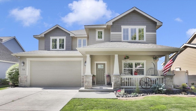 726 E Colbert Rd, Colbert, WA 99005 - craftsman house featuring covered porch, stone siding, driveway, an attached garage, and a shingled roof