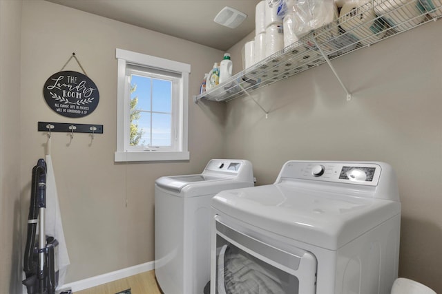 726 E Colbert Rd, Colbert, WA 99005 - laundry room with washing machine and dryer and wood finished floors