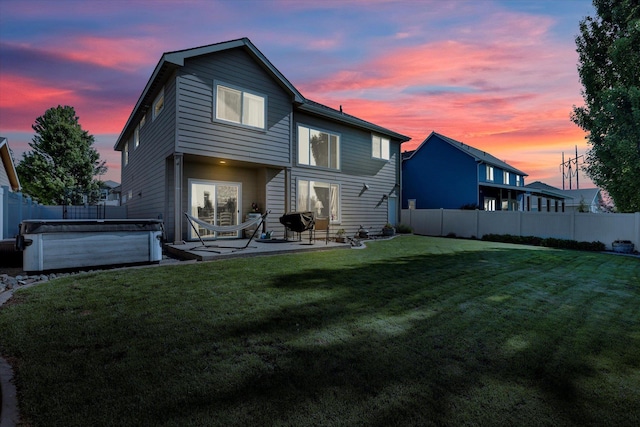 726 E Colbert Rd, Colbert, WA 99005 - back of house at dusk with a fenced backyard and a patio area