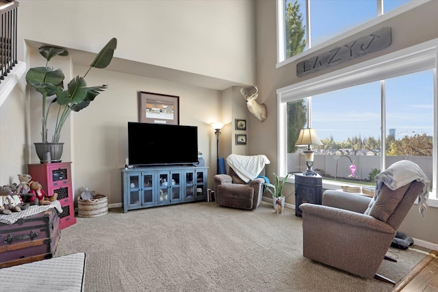 726 E Colbert Rd, Colbert, WA 99005 - carpeted living room with baseboards and a towering ceiling