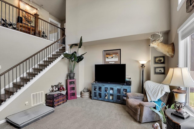 726 E Colbert Rd, Colbert, WA 99005 - living room with a high ceiling, stairway, carpet floors, and plenty of natural light