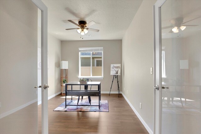 18381 E 17th Ave, Greenacres, WA 99016 - office featuring ceiling fan, french doors, and wood finished floors